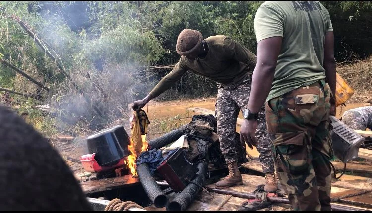 The military setting some of the mining equipments on fire